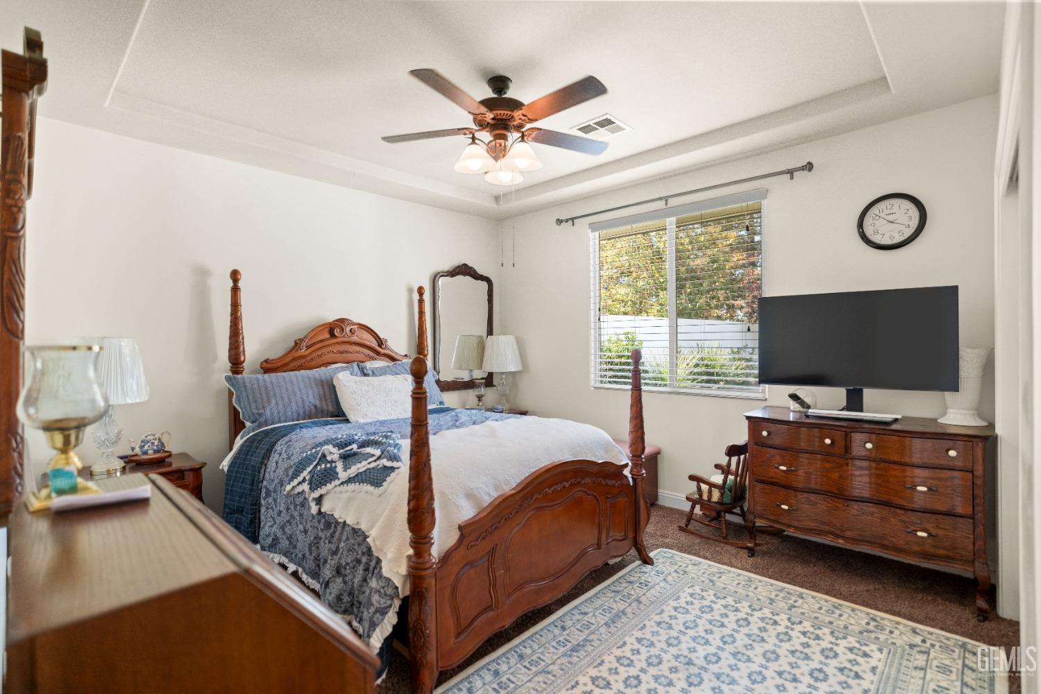 Undisclosed Address Bakersfield, CA 93311 - Photo 31 of 53 a bedroom with a bed and a flat screen tv