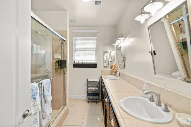 a utility room with cabinets washer and dryer