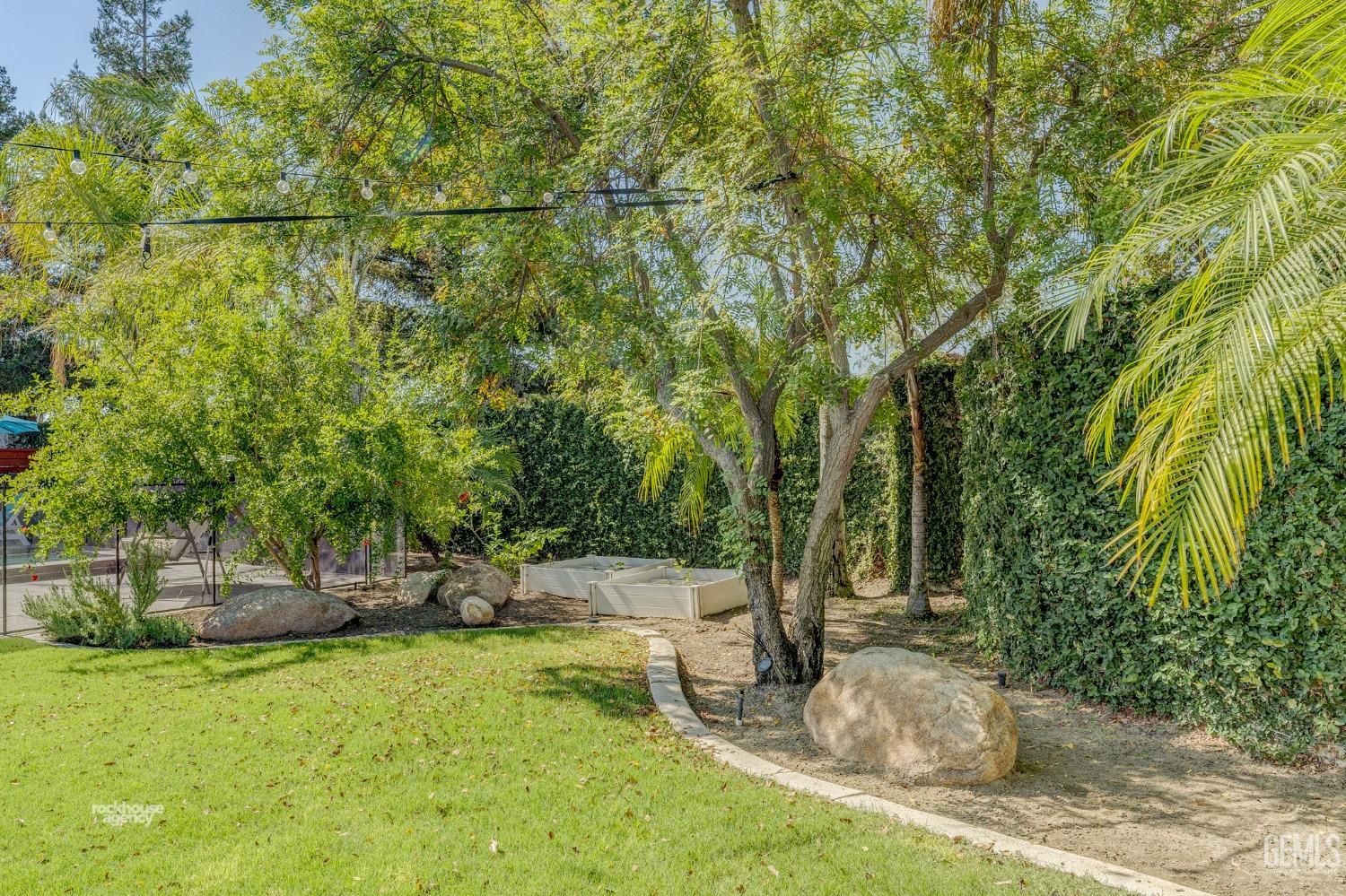 Undisclosed Address Bakersfield, CA 93311 - Photo 48 of 53 a backyard of a house with lots of green space