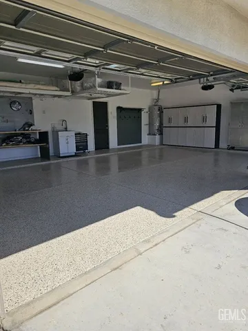 a front view of a house with lots of potted plants