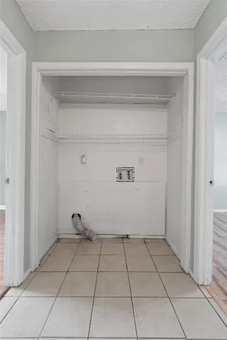 a view of a backyard with a large tree