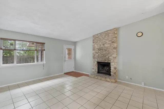 a view of an empty room with windows