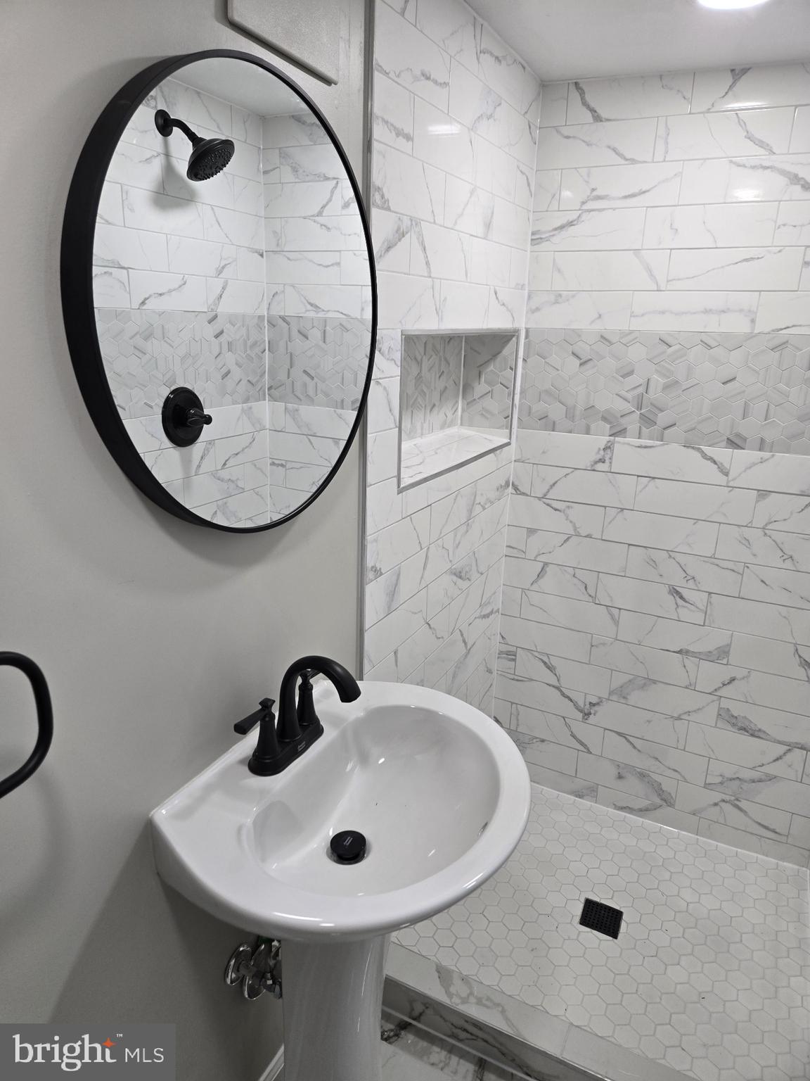 1016 Middleborough Road Essex, MD 21221 - Photo 13 of 33 a bathroom with a sink and a mirror