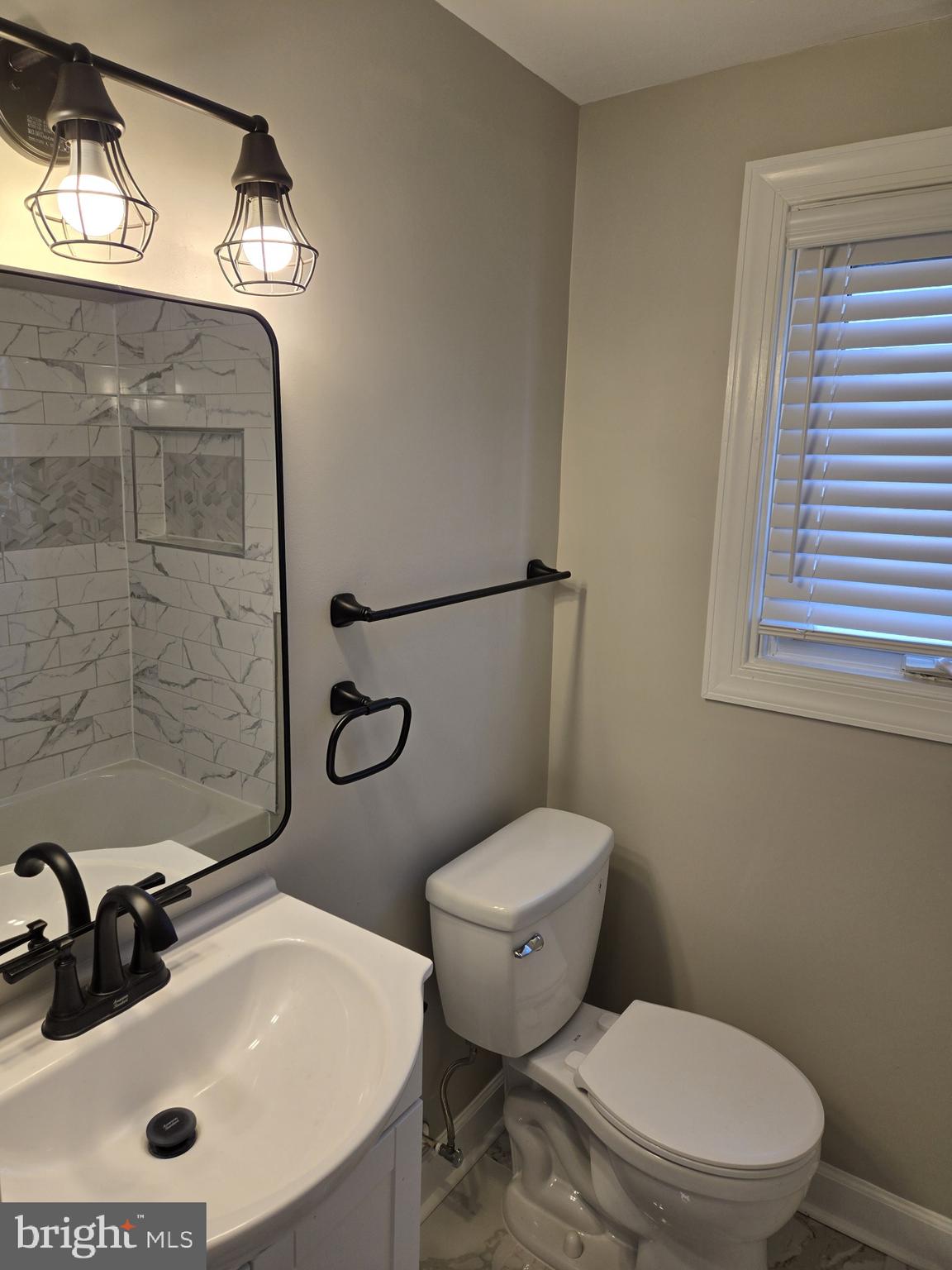 1016 Middleborough Road Essex, MD 21221 - Photo 15 of 33 a bathroom with a sink a toilet and shower