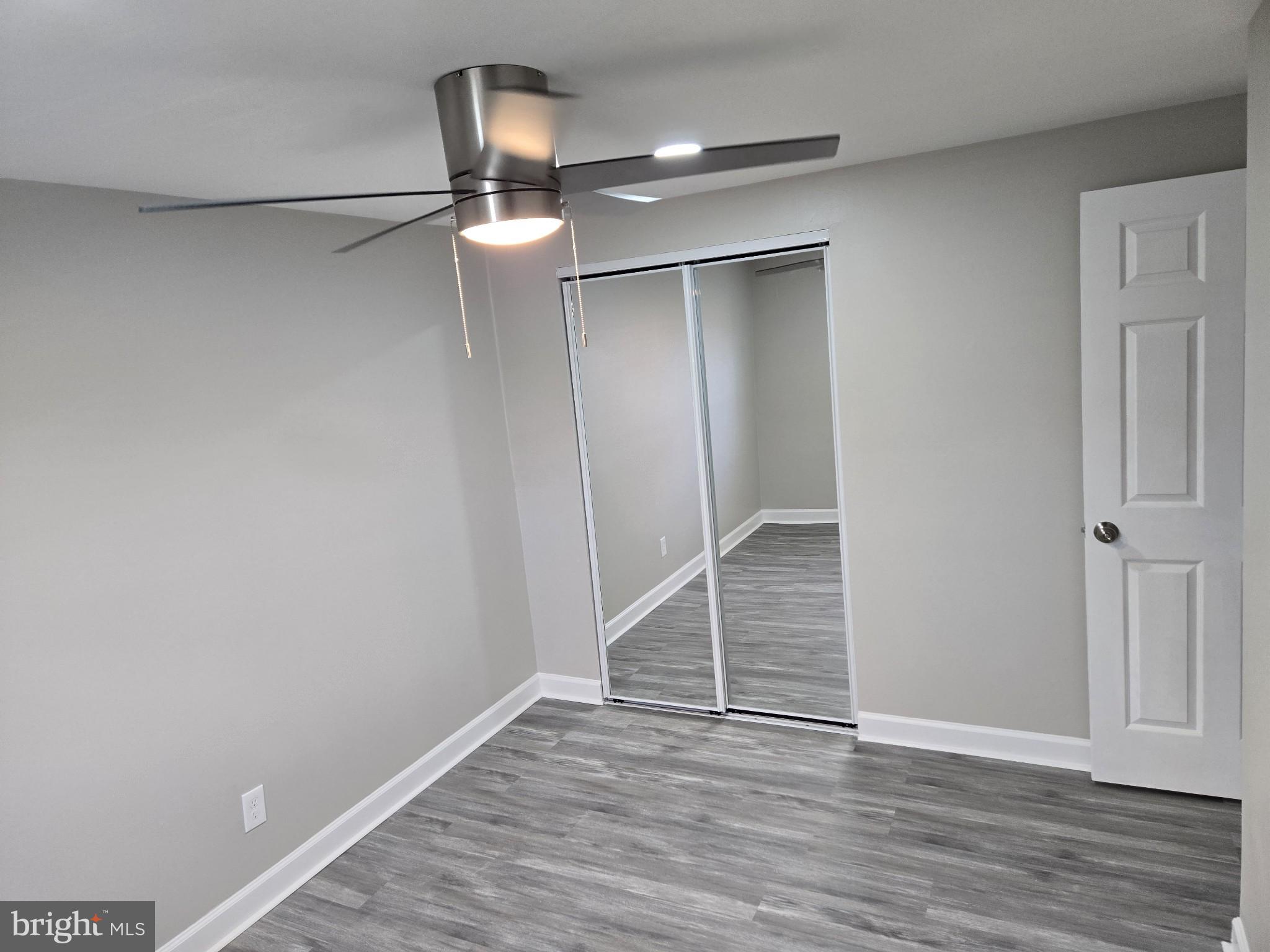 1016 Middleborough Road Essex, MD 21221 - Photo 18 of 33 a view of an empty room with wooden floor