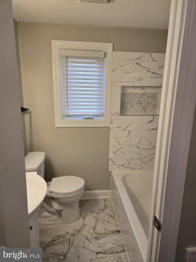 1016 Middleborough Road Essex, MD 21221 - Photo 26 of 33 a bathroom with a toilet and a shower