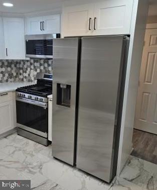 1016 Middleborough Road Essex, MD 21221 - Photo 4 of 33 a kitchen with granite countertop cabinets and steel stainless steel appliances
