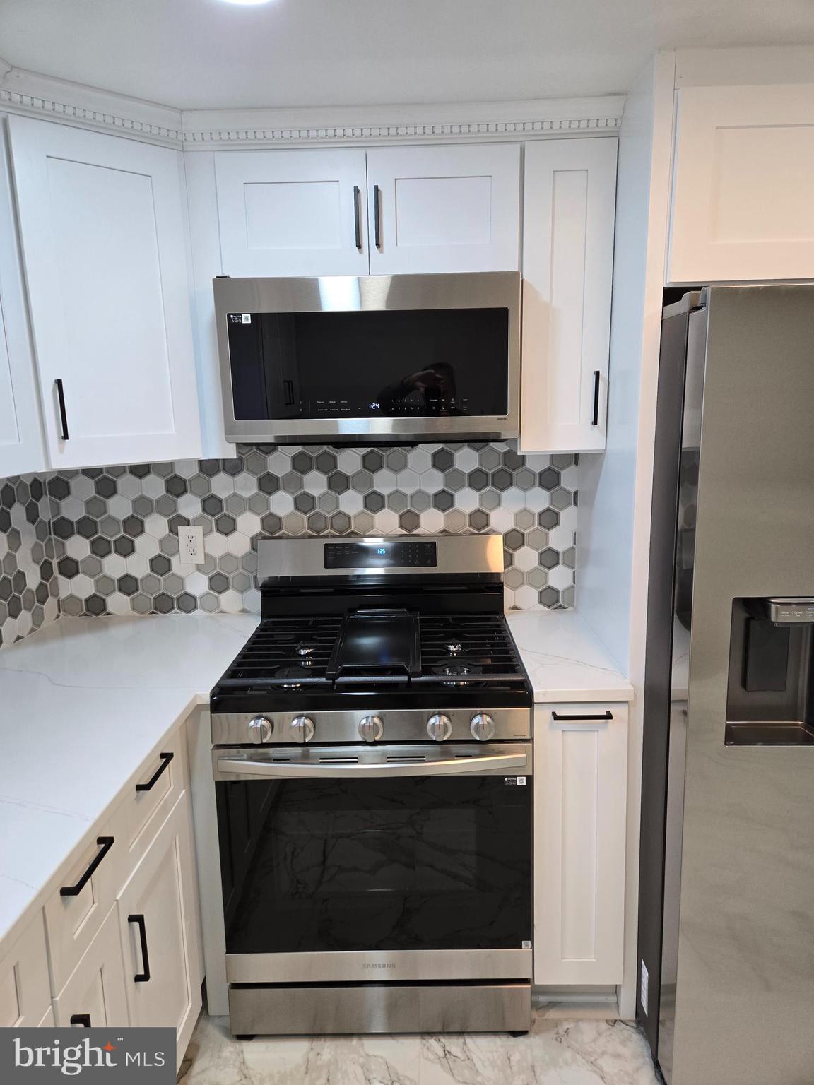 1016 Middleborough Road Essex, MD 21221 - Photo 6 of 33 a stove top oven sitting inside of a kitchen
