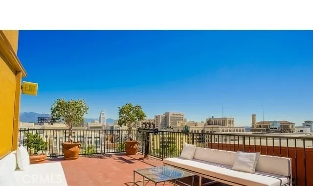 a view of a balcony with city view