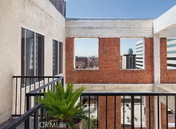 a view of balcony with furniture