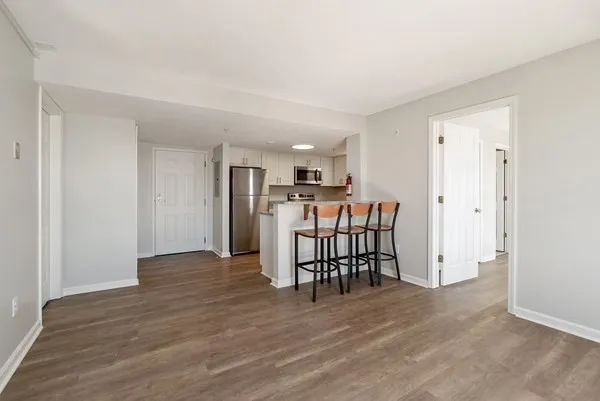 a view of a kitchen and dining room