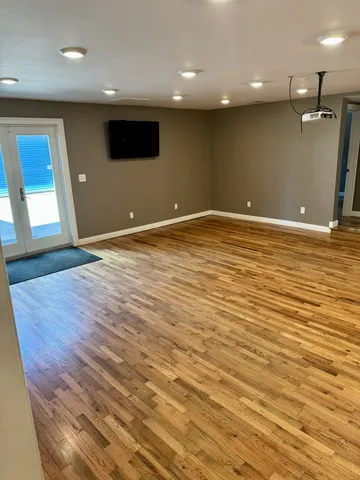 a bathroom with a granite countertop toilet sink and mirror