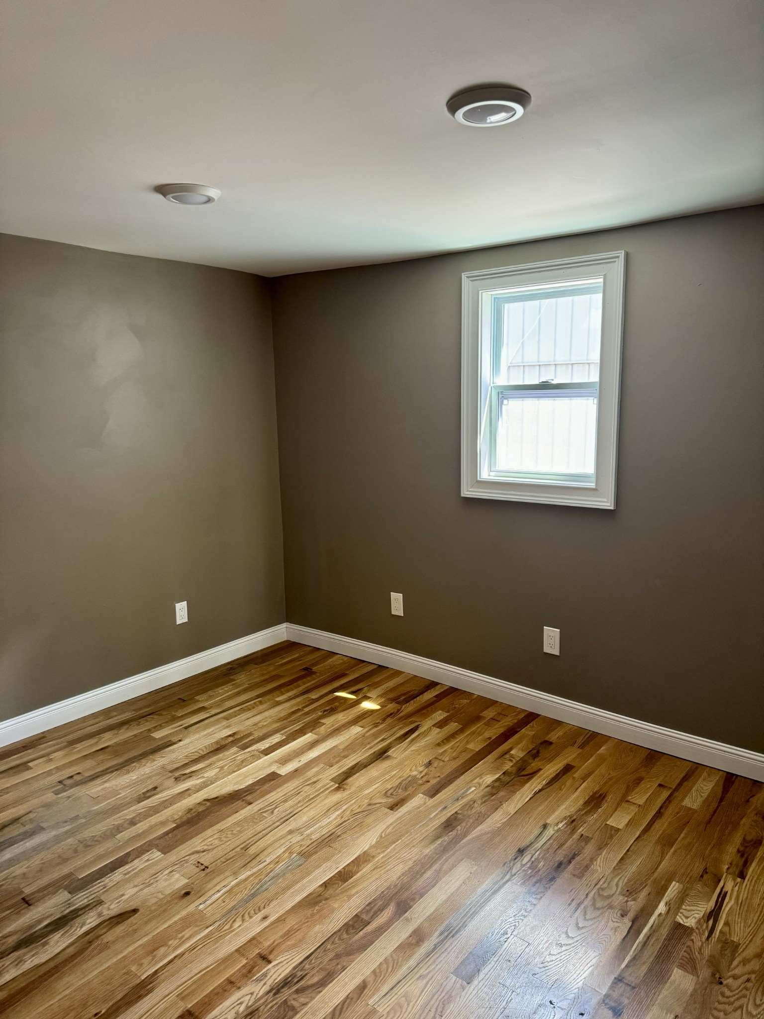 610 West Burton Street Murfreesboro, TN 37130 - Photo 18 of 32 a view of an empty room with wooden floor and a window