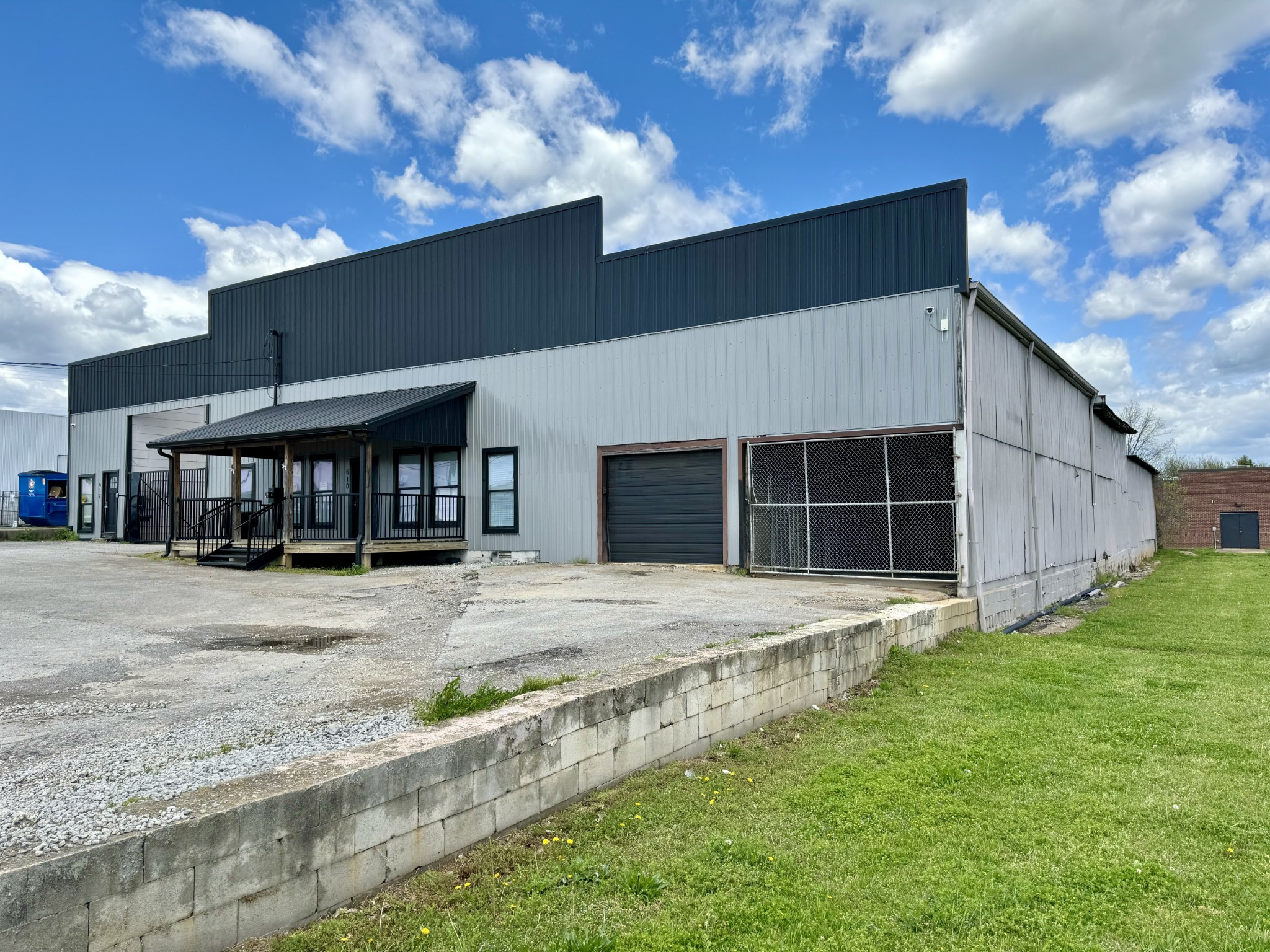 610 West Burton Street Murfreesboro, TN 37130 - Photo 2 of 32 a front view of a house with a yard and garage