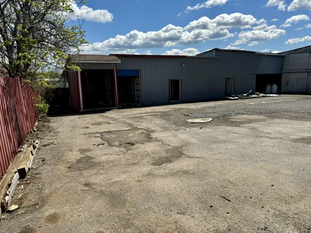a view of balcony with a yard