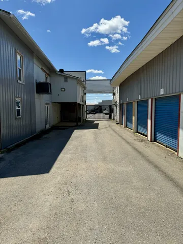 a view of a house with a backyard