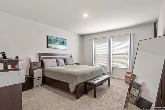 a bed room with a bed and a window