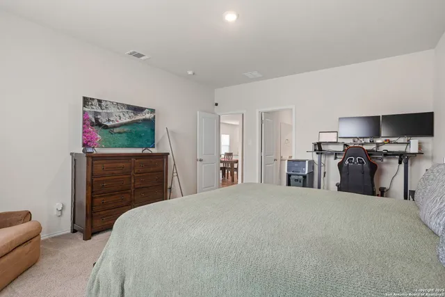 a bedroom with a bed and furniture