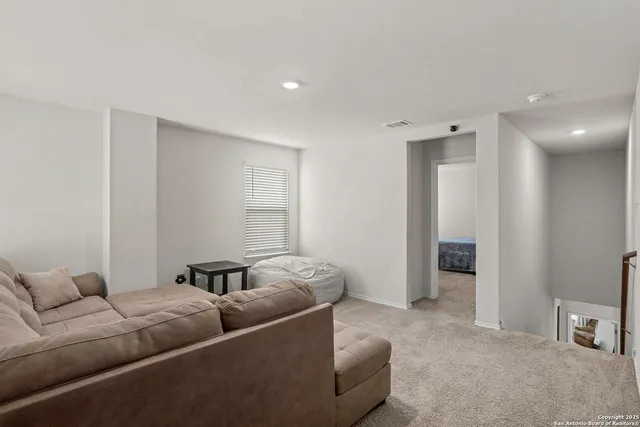 a living room with furniture and a couch