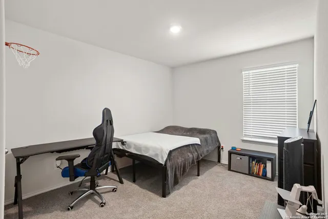 a bedroom with a workspace