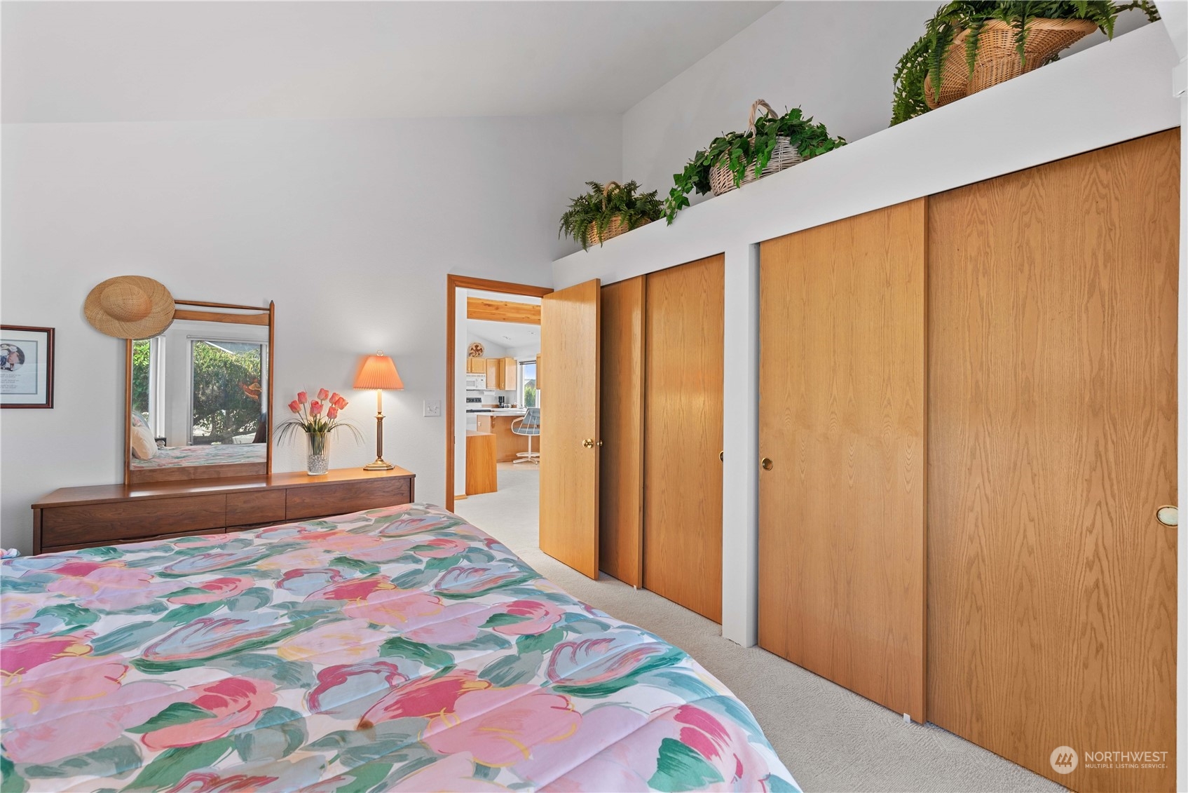 302 Butte Road Chelan, WA 98816 - Photo 13 of 35 a bedroom with a bed and a dresser next to a window