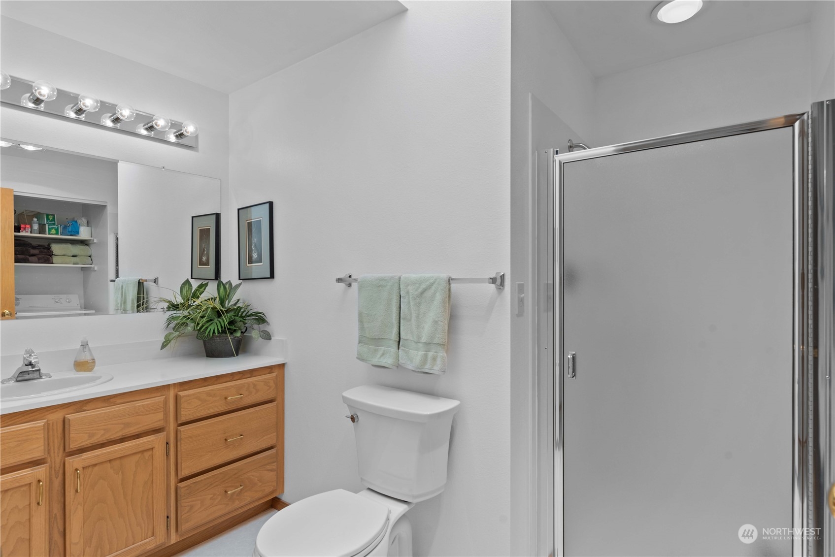 302 Butte Road Chelan, WA 98816 - Photo 14 of 35 a bathroom with a granite countertop sink toilet a large mirror and shower