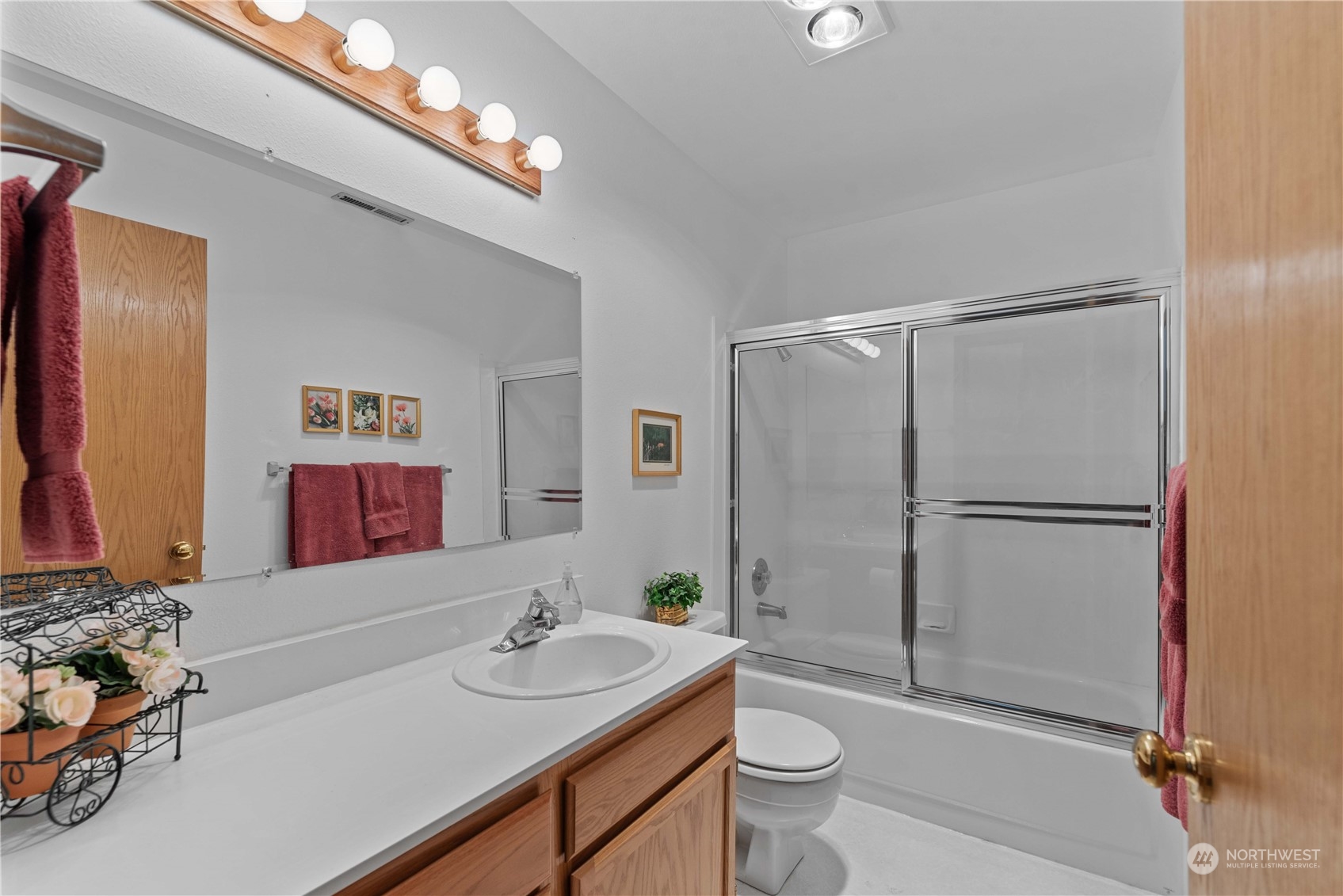 302 Butte Road Chelan, WA 98816 - Photo 18 of 35 a bathroom with a sink a toilet and shower