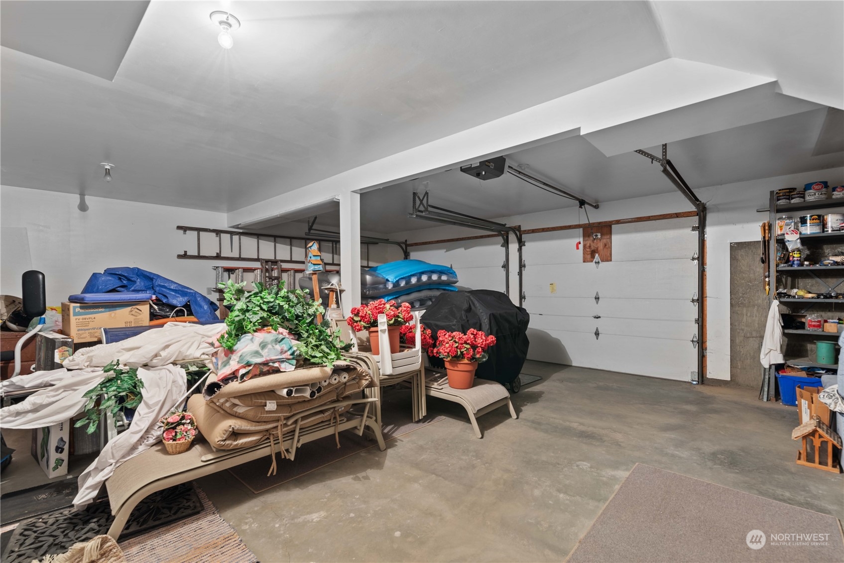 302 Butte Road Chelan, WA 98816 - Photo 20 of 35 a garage with furniture and clutter