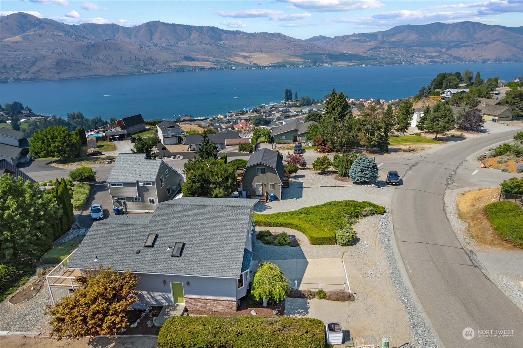 302 Butte Road Chelan, WA 98816 - Photo 2 of 35 an aerial view of a house with garden space and mountain view