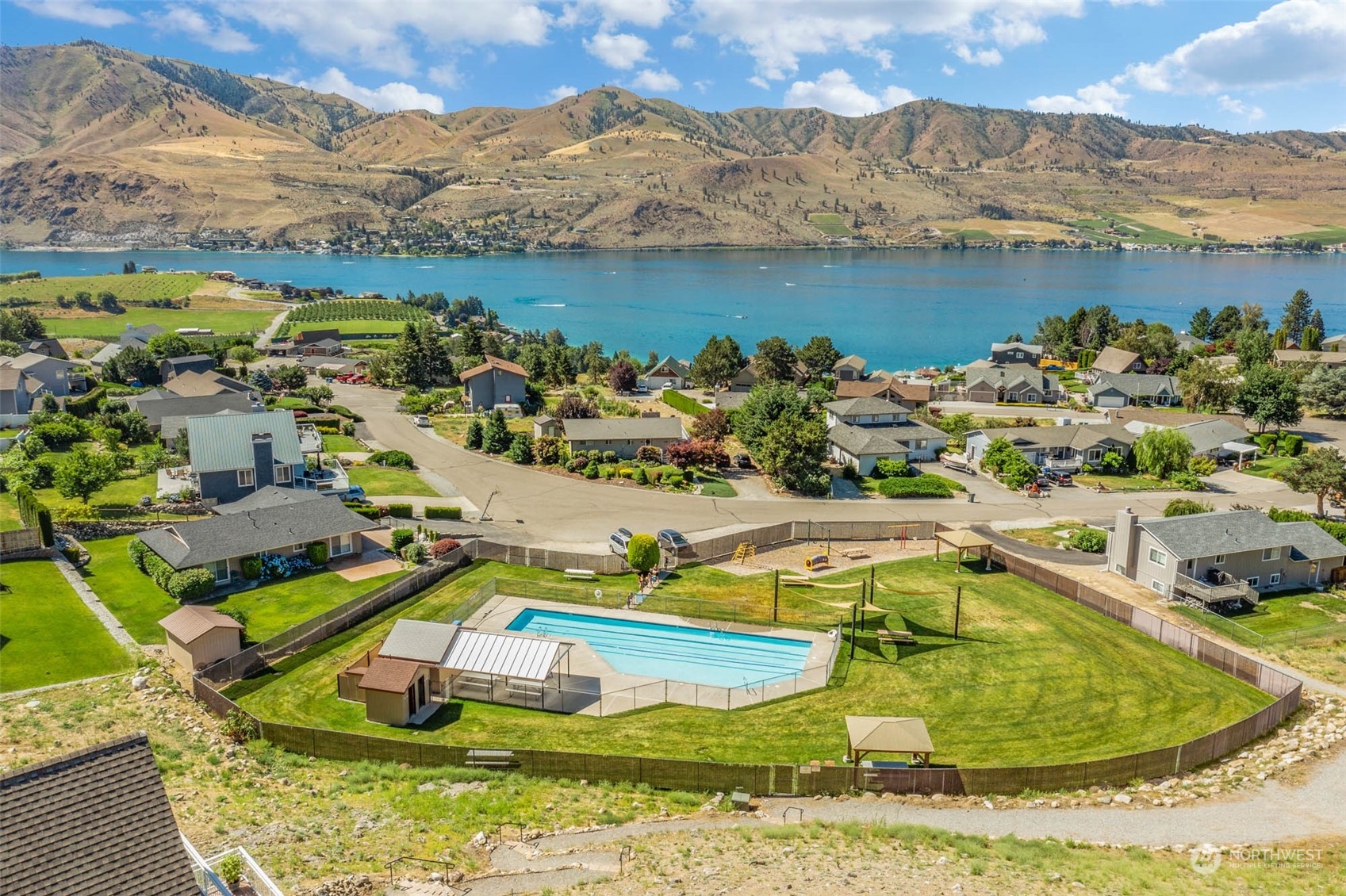 302 Butte Road Chelan, WA 98816 - Photo 34 of 35 a view of a swimming pool with a lake