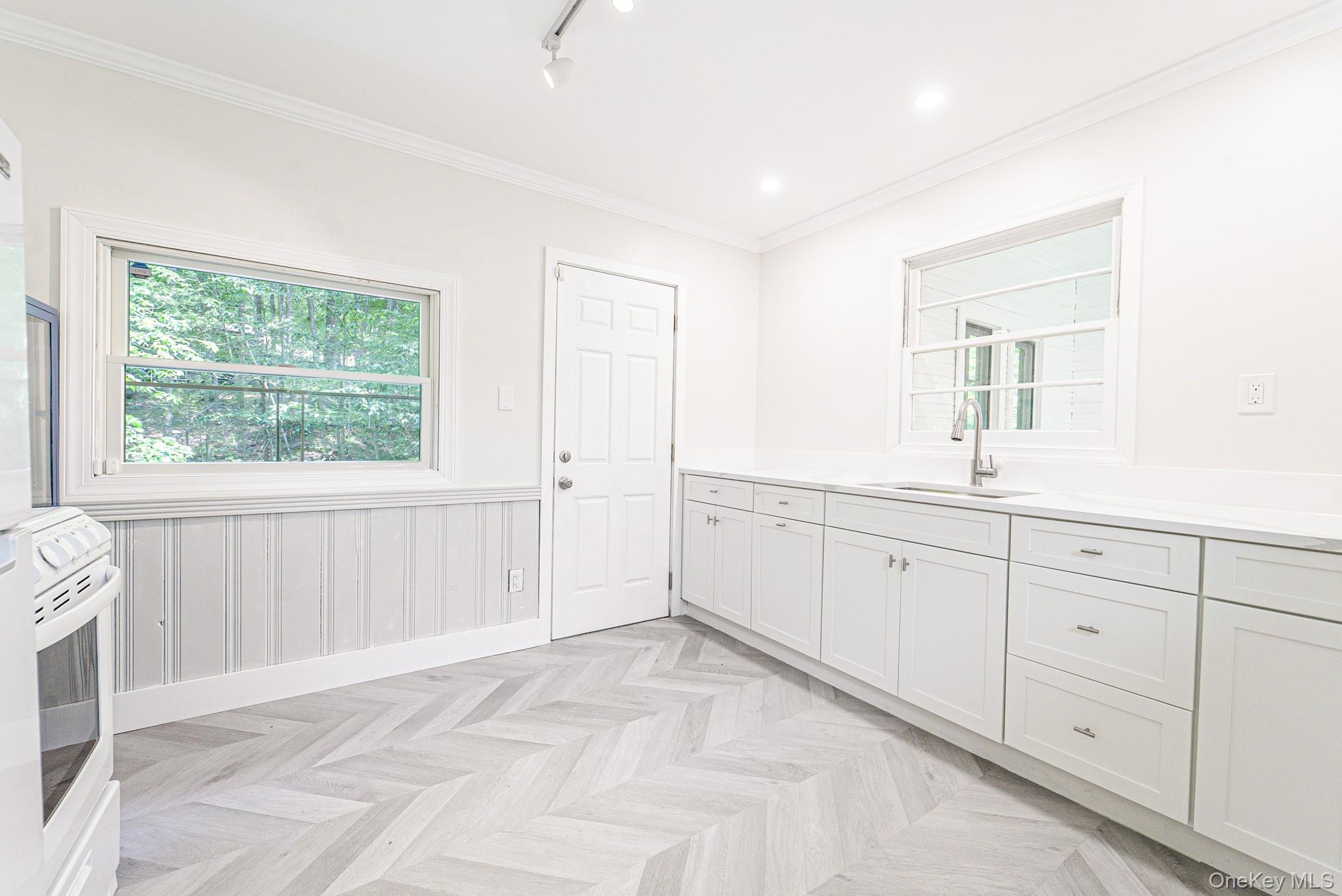 9 Higgins Trail Monroe, NY 10950 - Photo 16 of 24 a spacious bathroom with a double vanity sink a mirror and a window