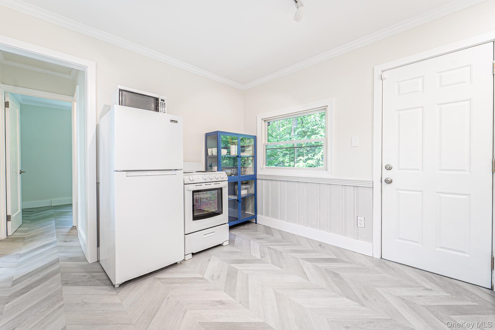9 Higgins Trail Monroe, NY 10950 - Photo 17 of 24 a white refrigerator freezer and a stove sitting inside of a kitchen