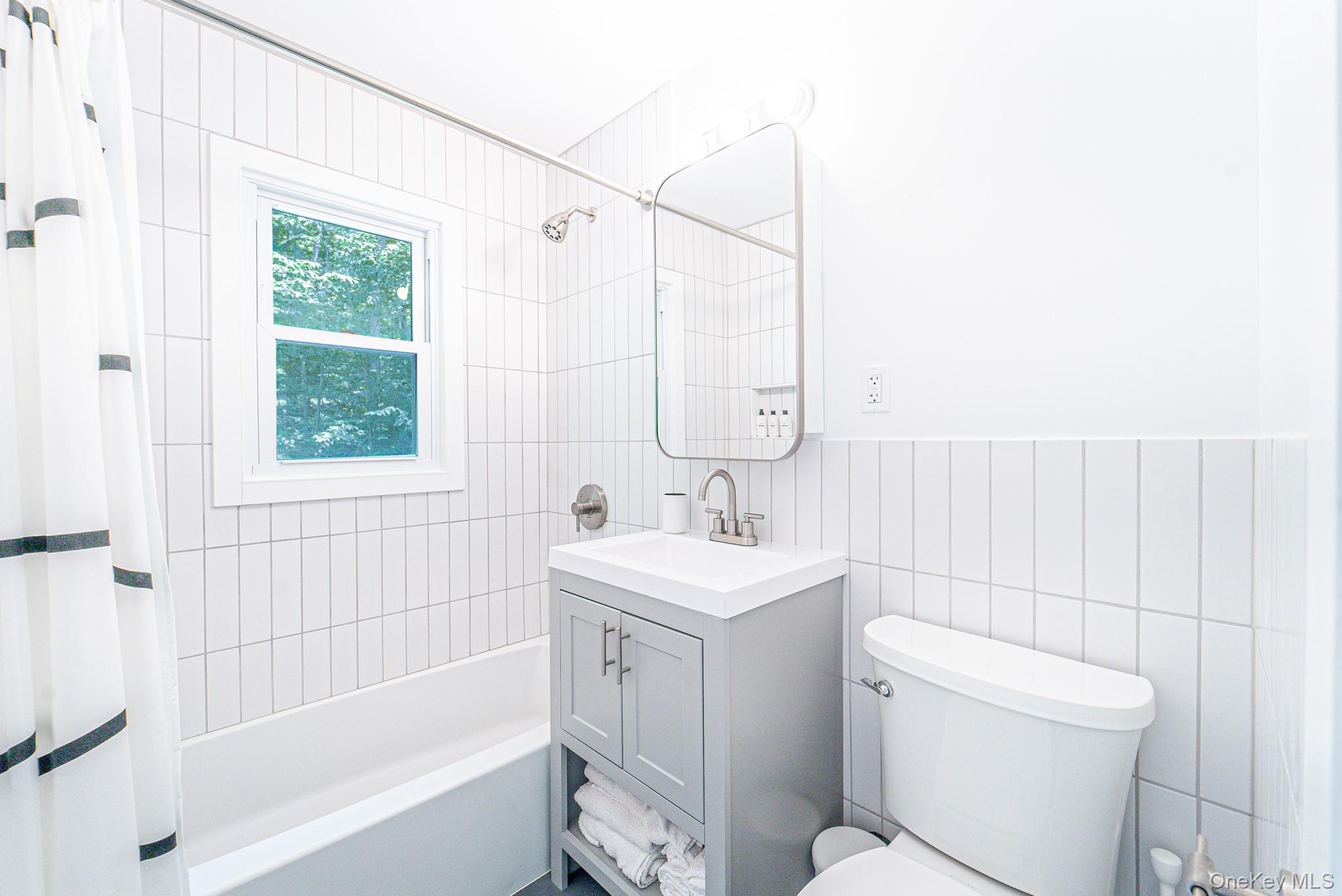9 Higgins Trail Monroe, NY 10950 - Photo 20 of 24 a bathroom with a sink toilet and shower