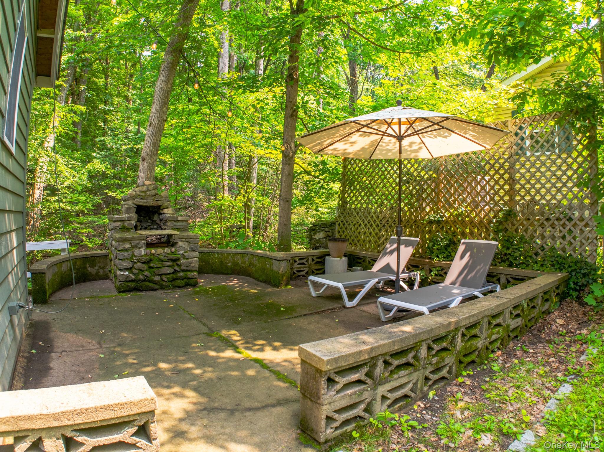 9 Higgins Trail Monroe, NY 10950 - Photo 3 of 24 a view of a chairs and table in the patio
