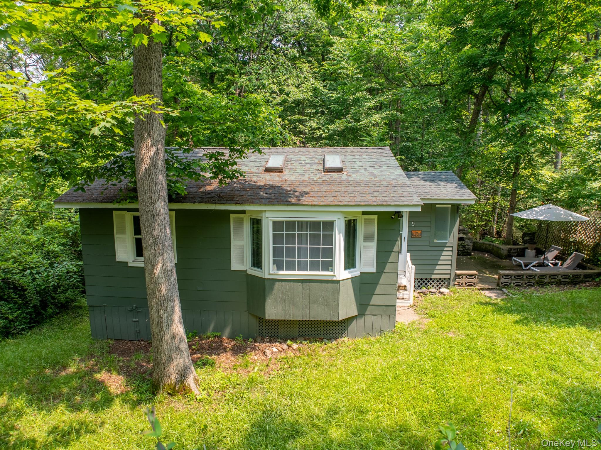 9 Higgins Trail Monroe, NY 10950 - Photo 4 of 24 a view of a house with swimming pool next to a yard