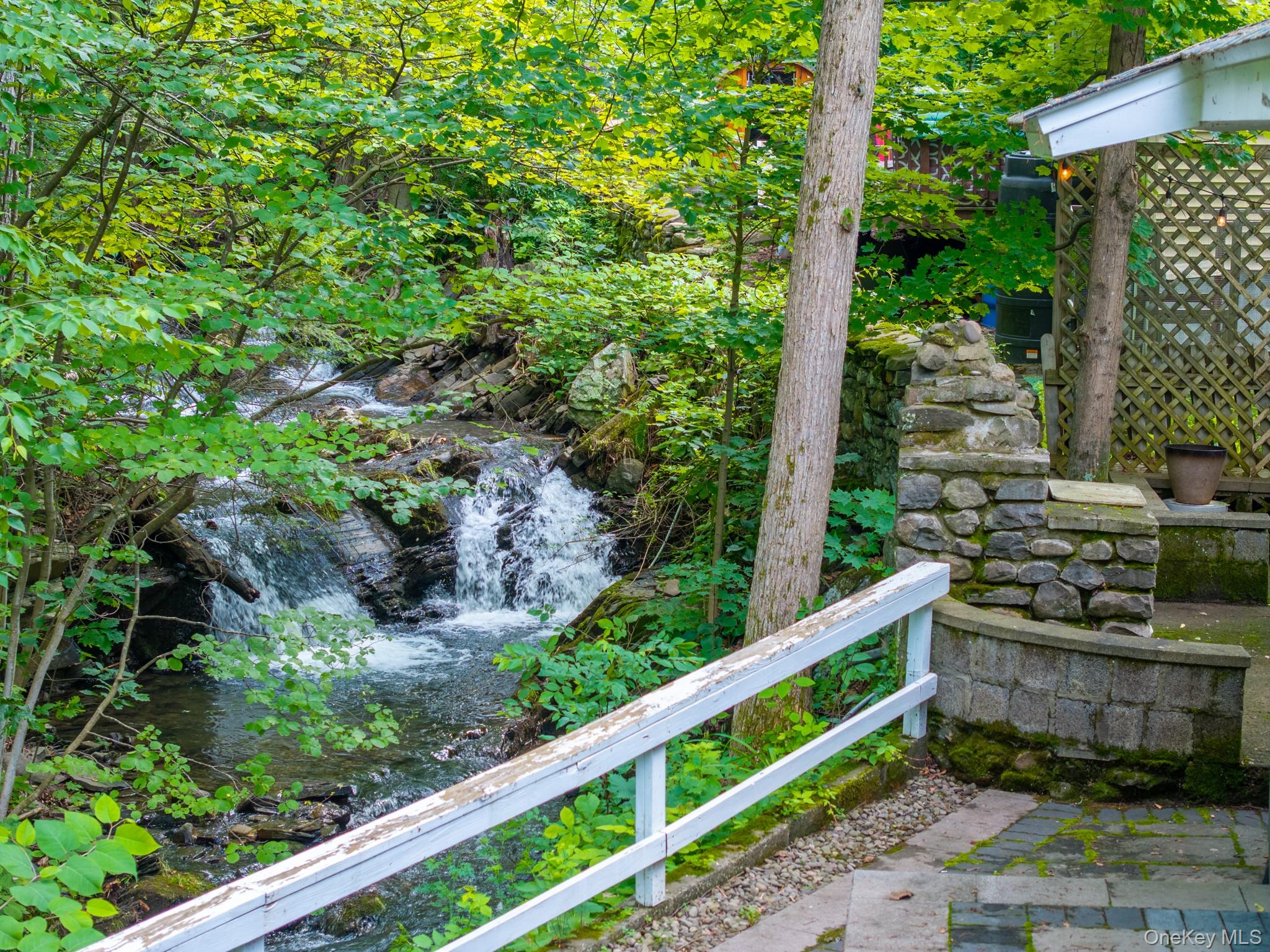 9 Higgins Trail Monroe, NY 10950 - Photo 7 of 24 a view of a garden with wooden fence