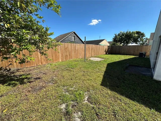 a view of backyard with green space