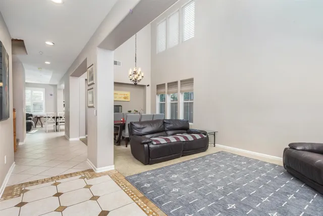 a living room with furniture and a table