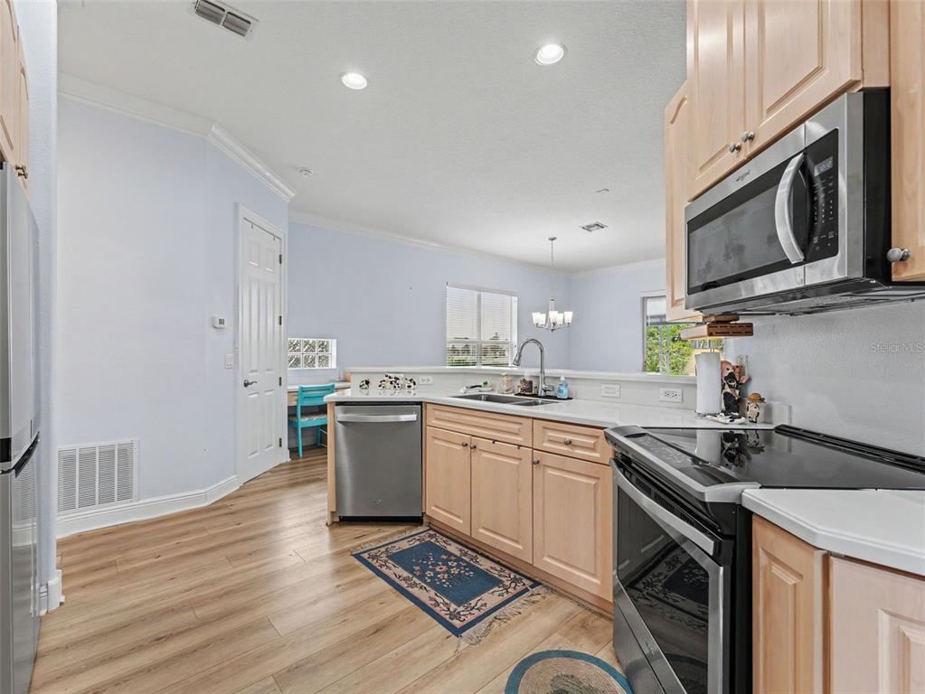 8910 Jericho Road Weeki Wachee, FL 34613 - Photo 28 of 52 a kitchen with a sink stove and microwave