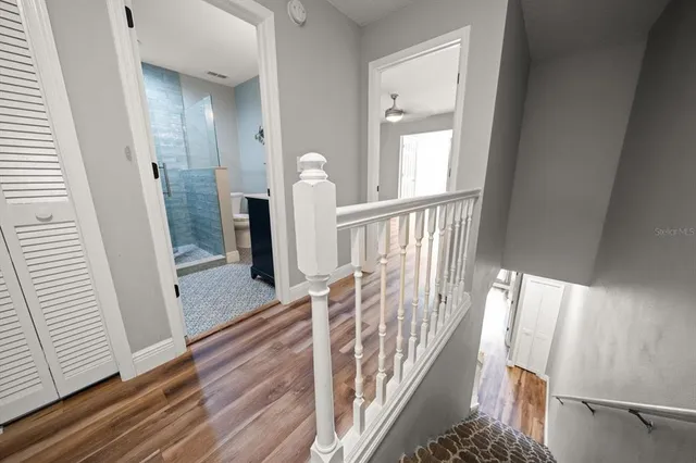 a spacious bedroom with a bed and a window