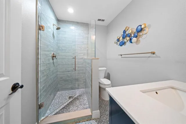 a bathroom with a sink mirror and a sink