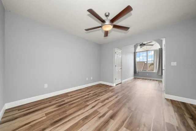 a view of hallway with wooden floor