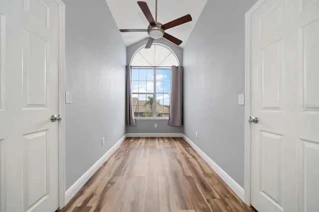 a front view of a house with plants