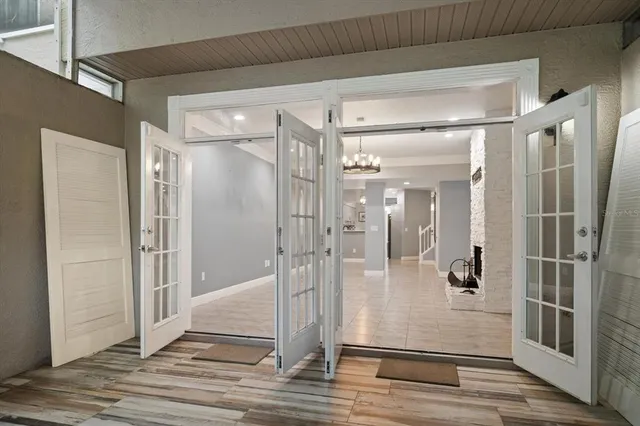 a bathroom with a glass shower door and a mirror