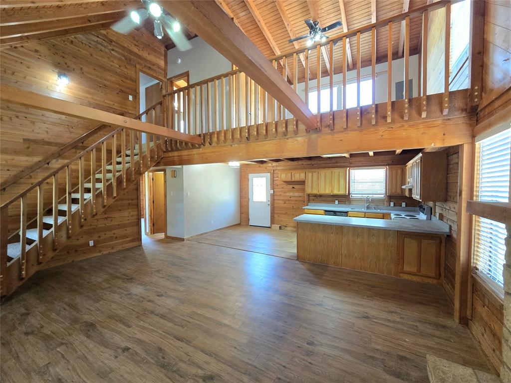 3505 Farmer Road Azle, TX 76020 - Photo 5 of 40 Living room opens to the kitchen, complete with a breakfast bar at the storage peninsula!