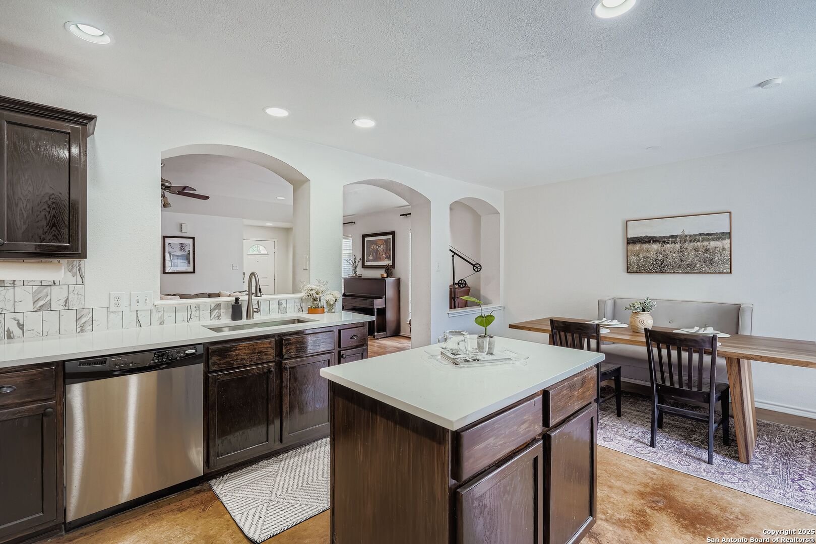 15406 Spring Dew San Antonio, TX 78247 - Photo 11 of 26 a view of a kitchen area with furniture and sink