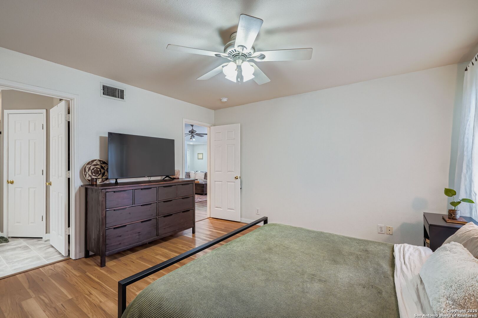 15406 Spring Dew San Antonio, TX 78247 - Photo 14 of 26 a living room with furniture and a flat screen tv
