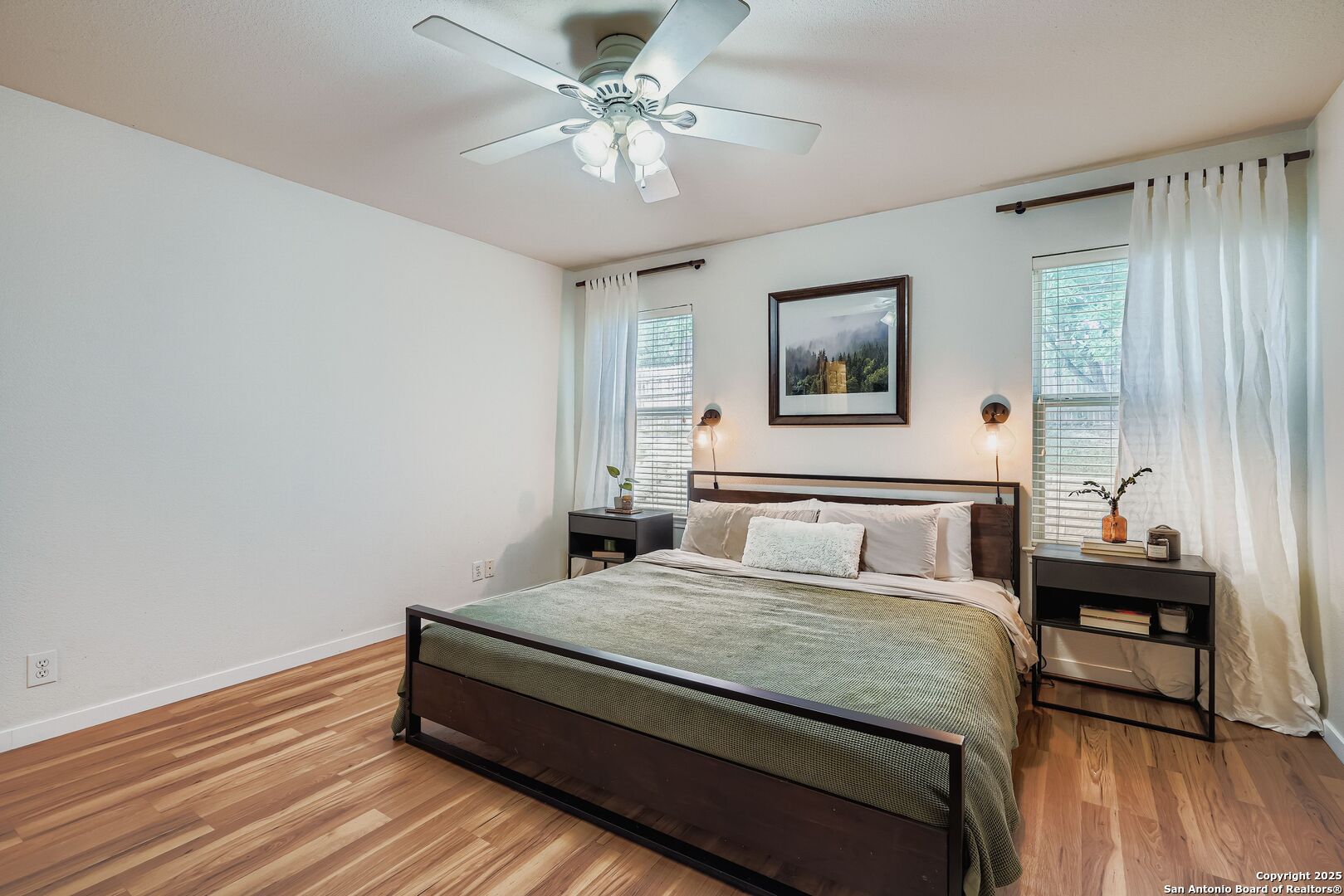 15406 Spring Dew San Antonio, TX 78247 - Photo 15 of 26 a bedroom with a bed and a table