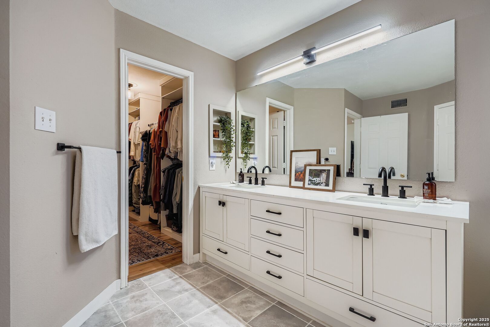 15406 Spring Dew San Antonio, TX 78247 - Photo 17 of 26 a bathroom with a sink a mirror and shower