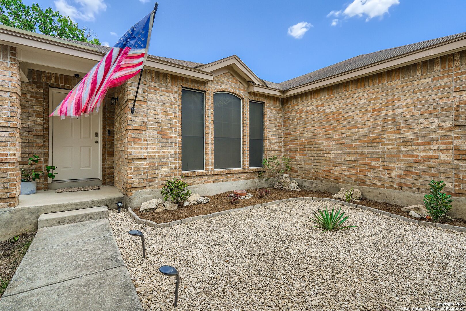 15406 Spring Dew San Antonio, TX 78247 - Photo 2 of 26 a front view of a house with a yard
